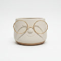 macetero gafas dorado